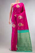 Pure Silk Dark Pink Kanjivaram Saree with Zari Butta on the body and Without Border.  displayed on a mannequin