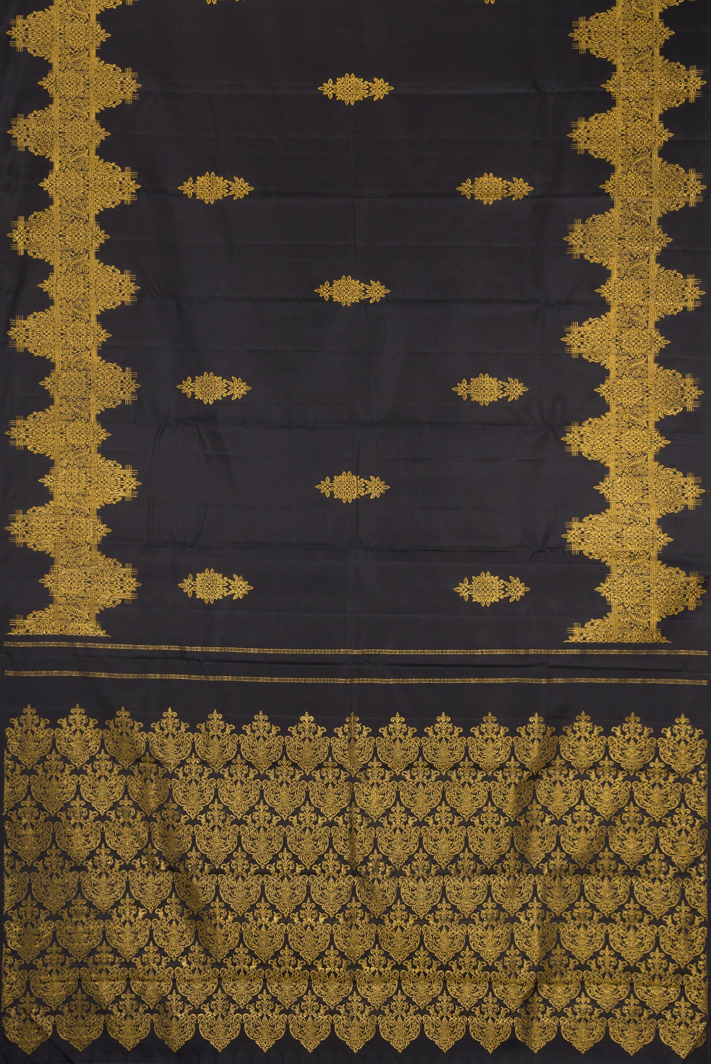 Flat view of Black Kanjivaram Silk Saree with Zari Butta on the body and Fancy Border. 