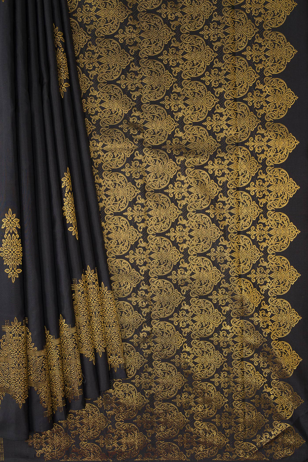 Pleats and pallu of Black Kanjivaram Silk Saree with Zari Butta on the body and Fancy Border. 