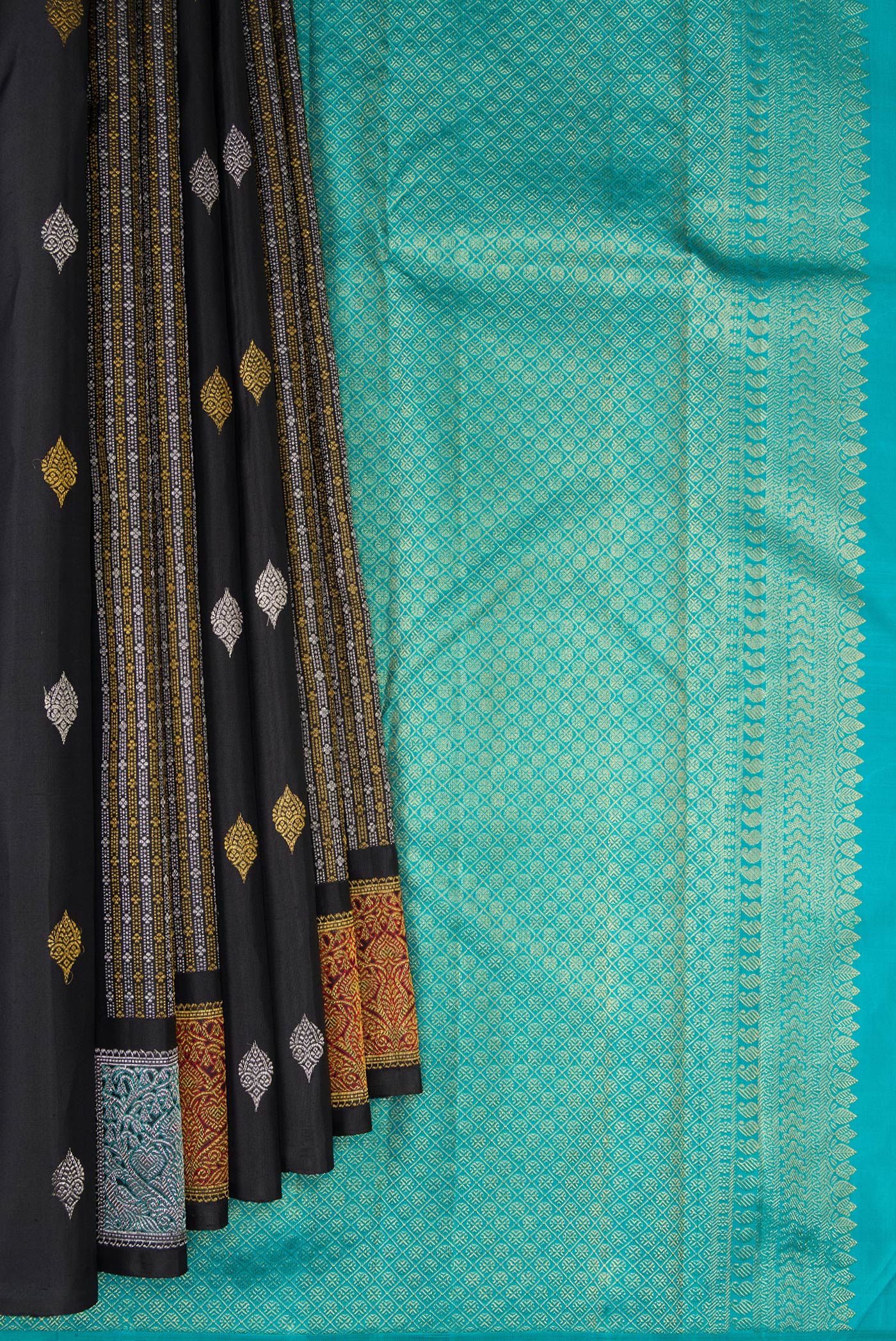 Pleats and pallu of Black Kanjivaram Silk Saree with Zari Butta on the body and Without Border. 