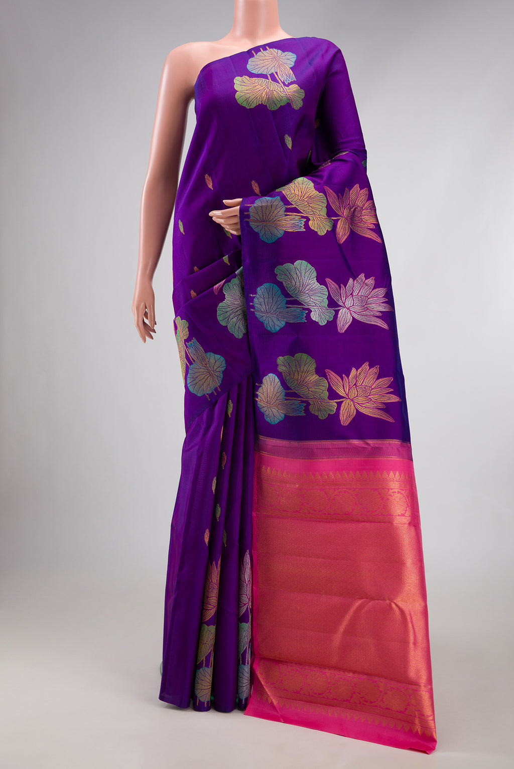 Violet Kanjivaram Silk Saree with Zari And Thread Butta on the body and Without Border.  displayed on a mannequin