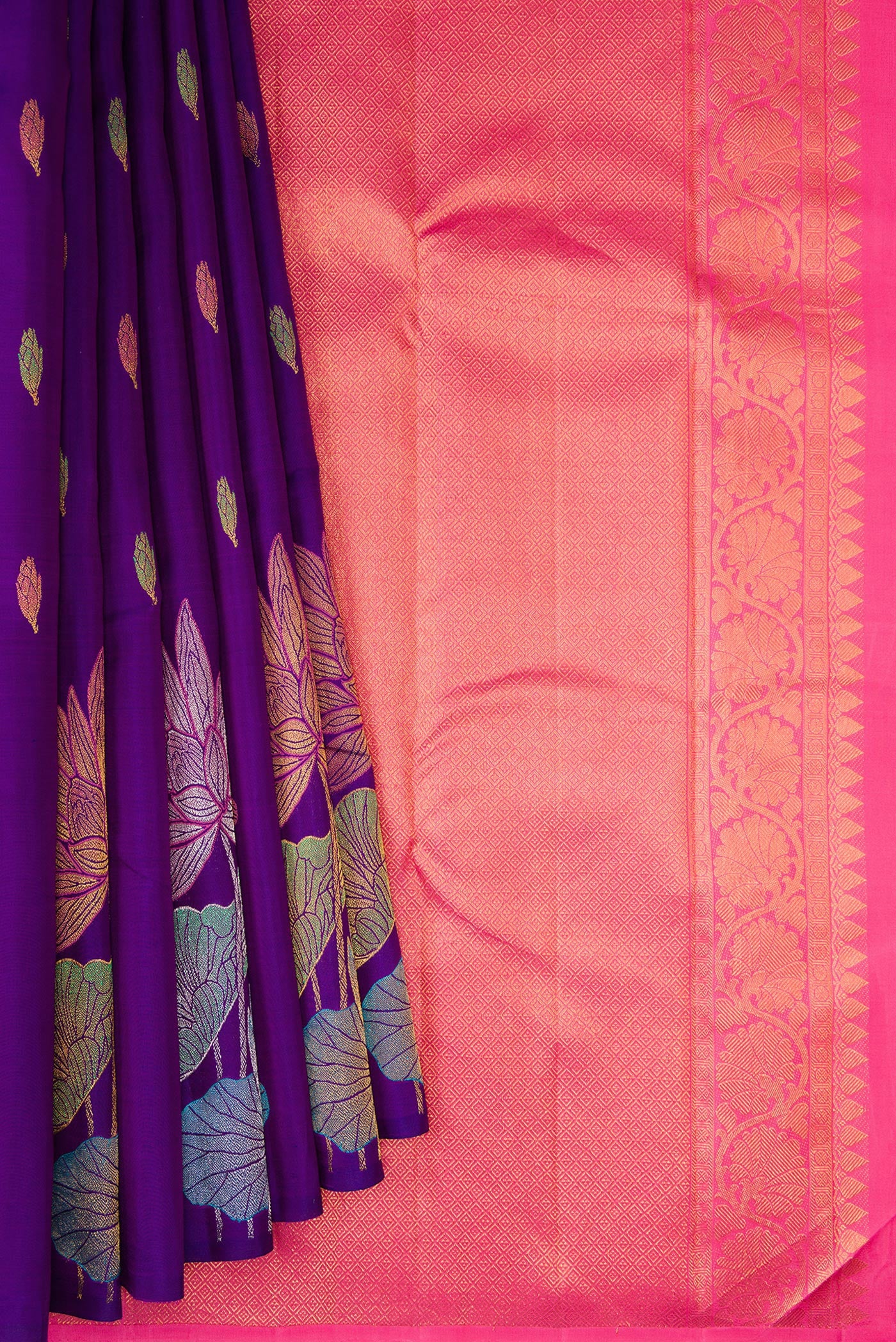 Pleats and pallu of Violet Kanjivaram Silk Saree with Zari And Thread Butta on the body and Without Border. 