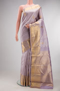Pure Silk Lavender Kanjivaram Saree with Zari Brocade on the body and Zari Border.  displayed on a mannequin