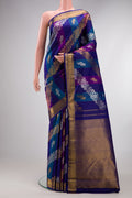 Multi Color Kanchipuram Silk Saree with Zari Brocade on the body and Zari Border.  displayed on a mannequin
