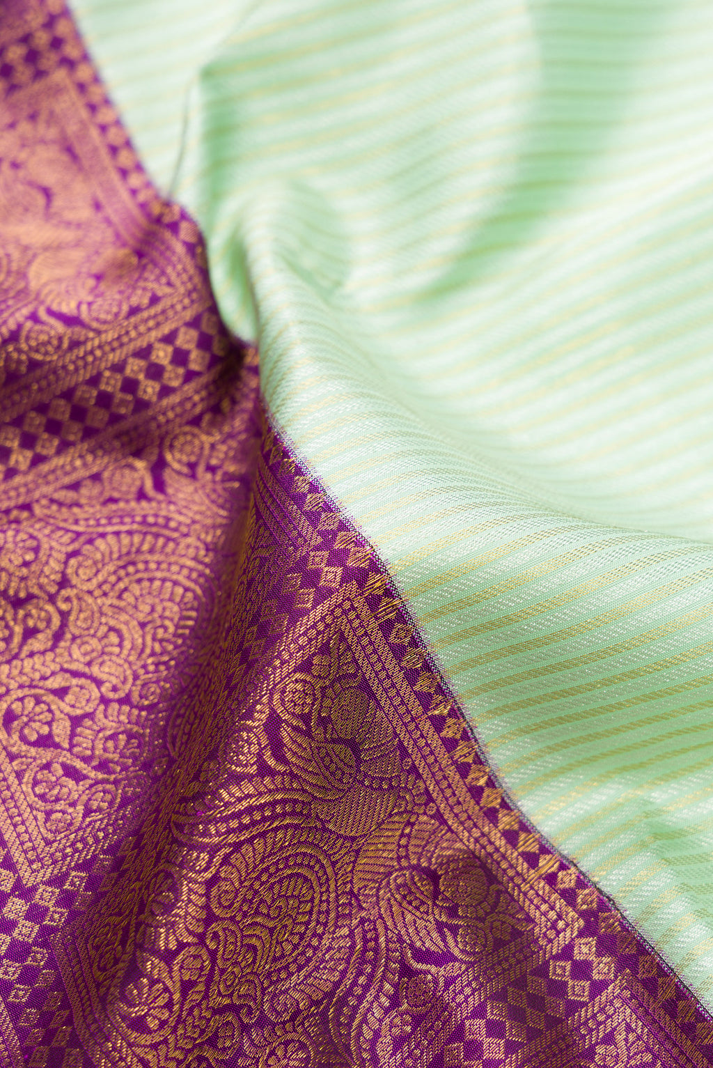 Close up of Pure Silk Multi Color Kanjivaram Saree with Half And Half on the body and Without Border.  displaying folds