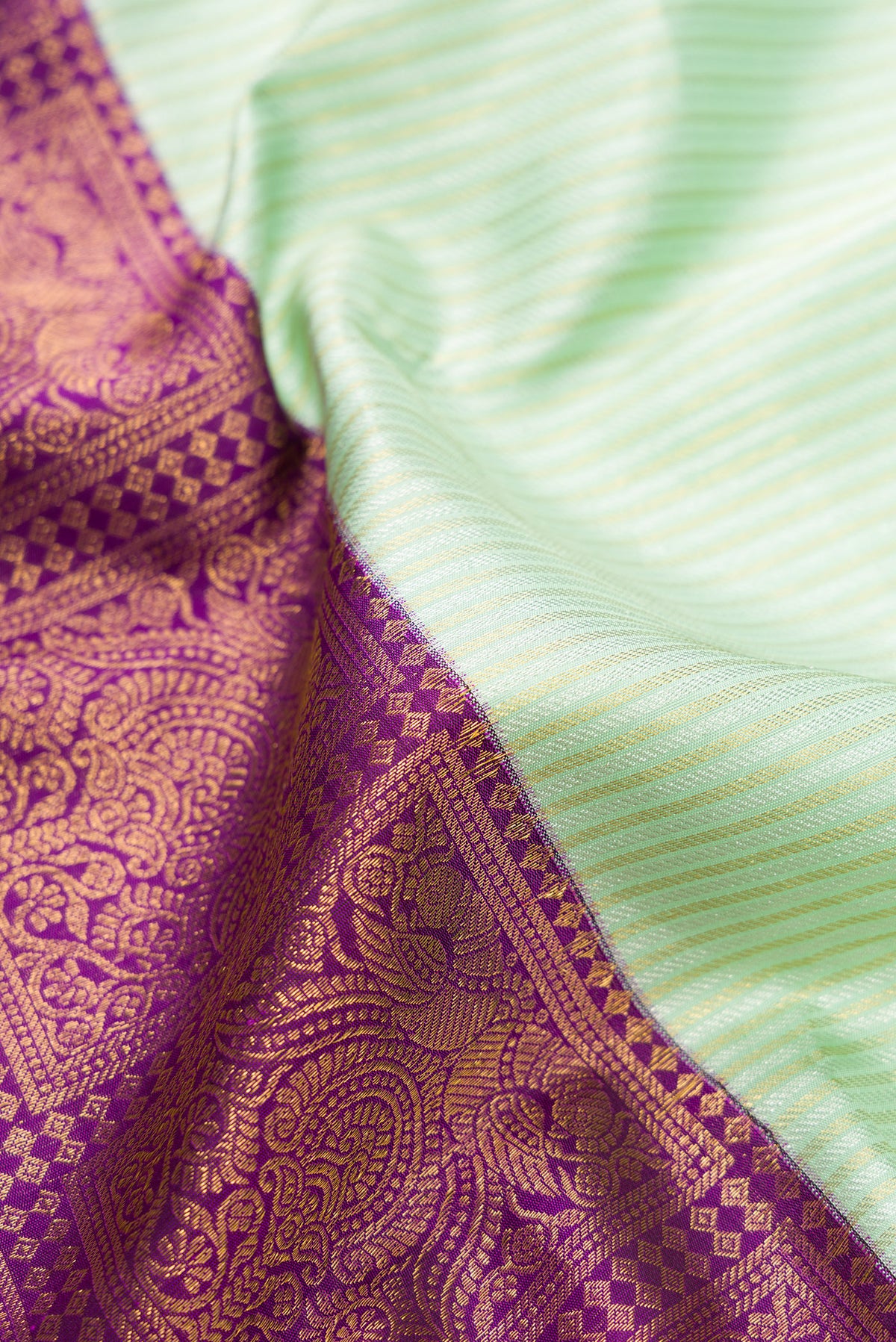 Close up of Pure Silk Multi Color Kanjivaram Saree with Half And Half on the body and Without Border.  displaying folds