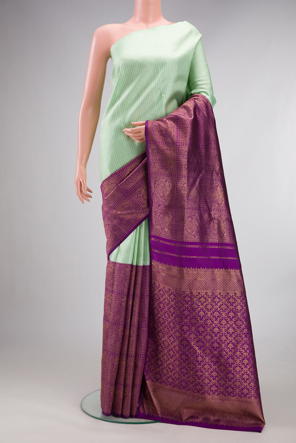Pure Silk Multi Color Kanjivaram Saree with Half And Half on the body and Without Border.  displayed on a mannequin
