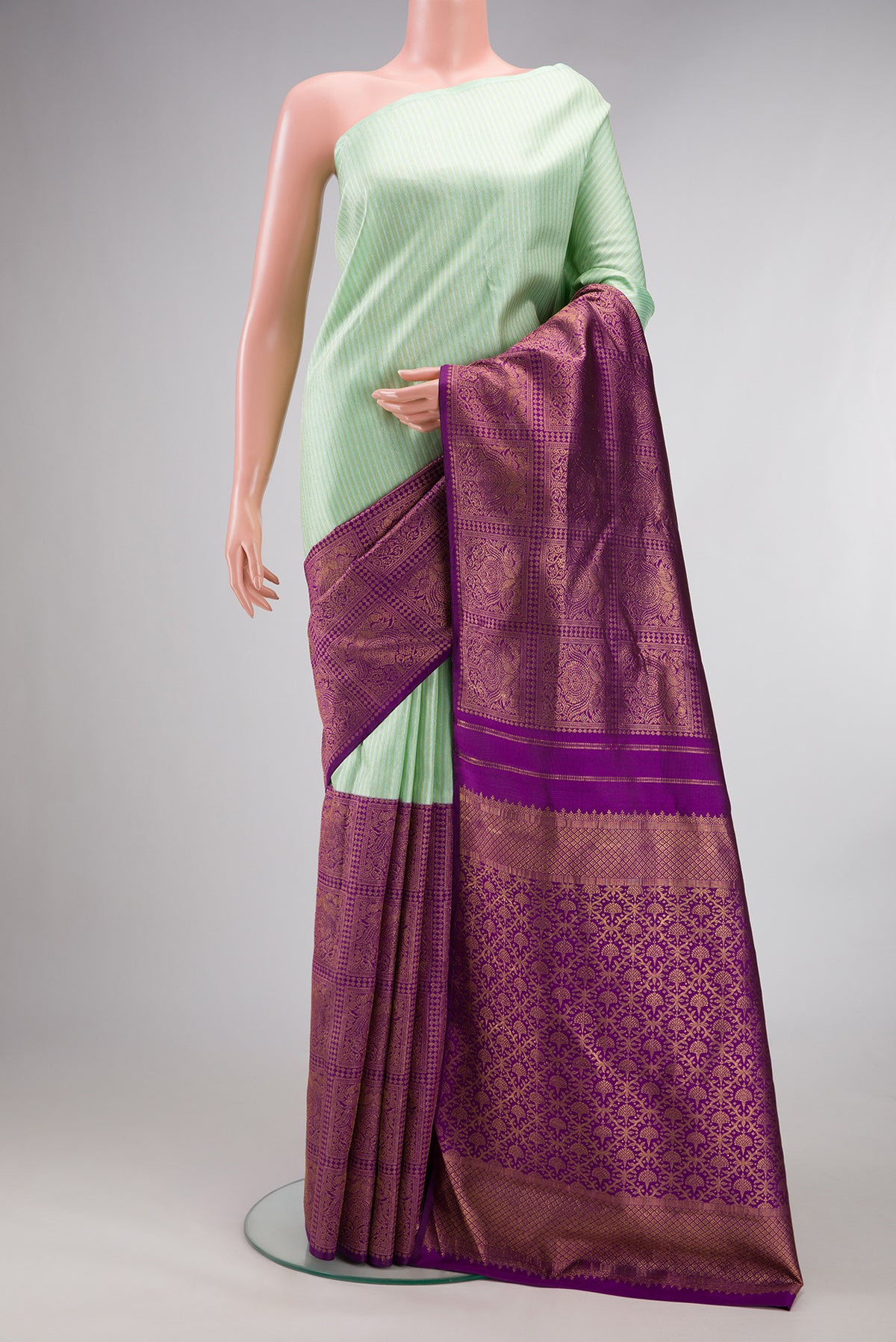 Pure Silk Multi Color Kanjivaram Saree with Half And Half on the body and Without Border.  displayed on a mannequin
