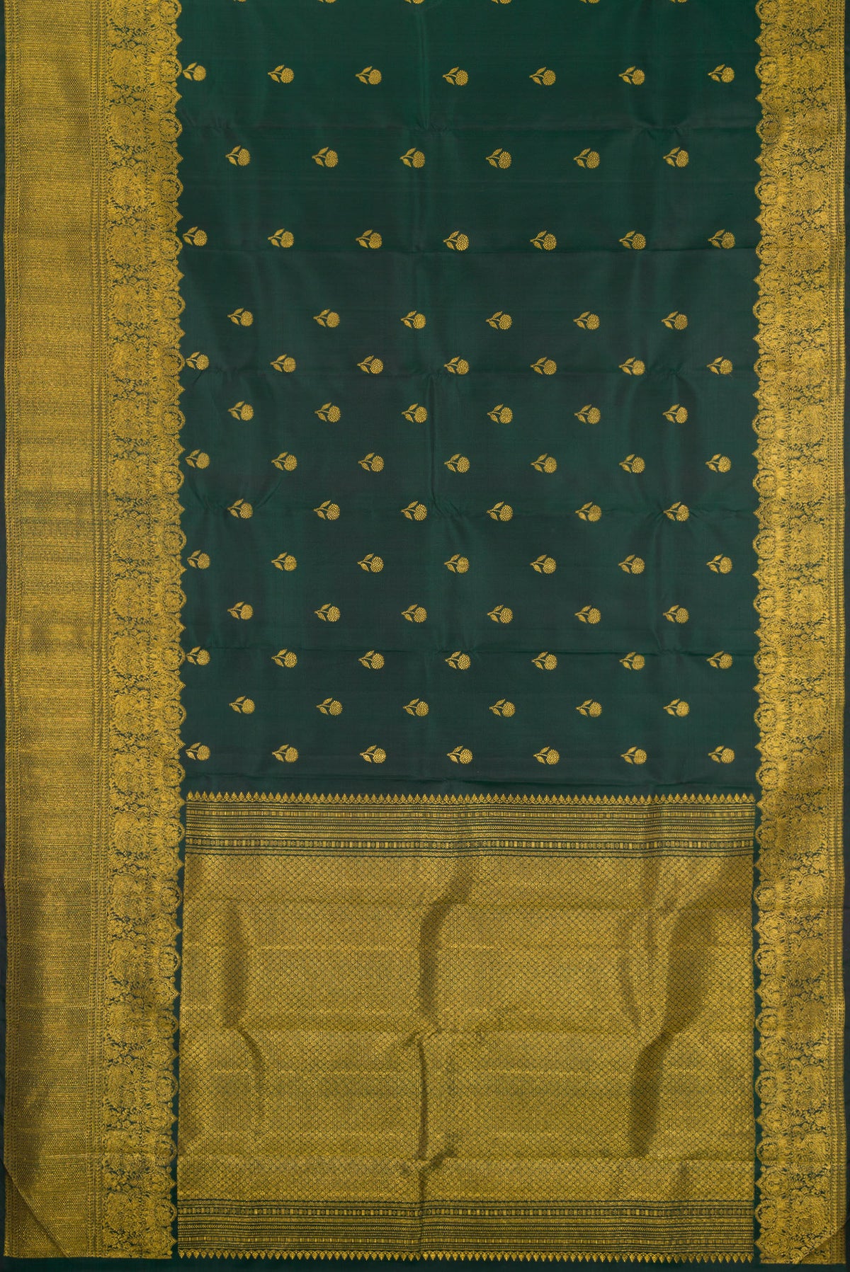 Flat view of Bottle Green Kanjivaram Silk Saree with Zari Butta on the body and Fancy Border. 