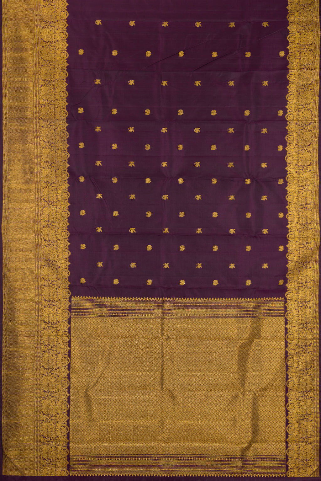 Flat view of Burgundy Kanjivaram Silk Saree with Zari Butta on the body and Zari Border. 