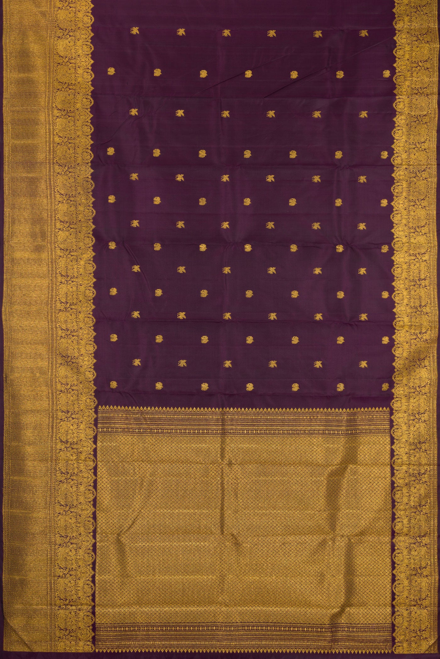 Flat view of Burgundy Kanjivaram Silk Saree with Zari Butta on the body and Zari Border. 