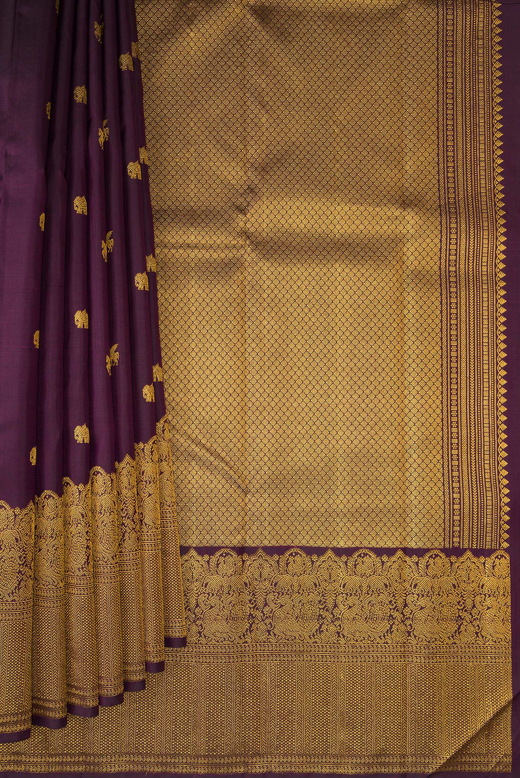 Pleats and pallu of Burgundy Kanjivaram Silk Saree with Zari Butta on the body and Zari Border. 