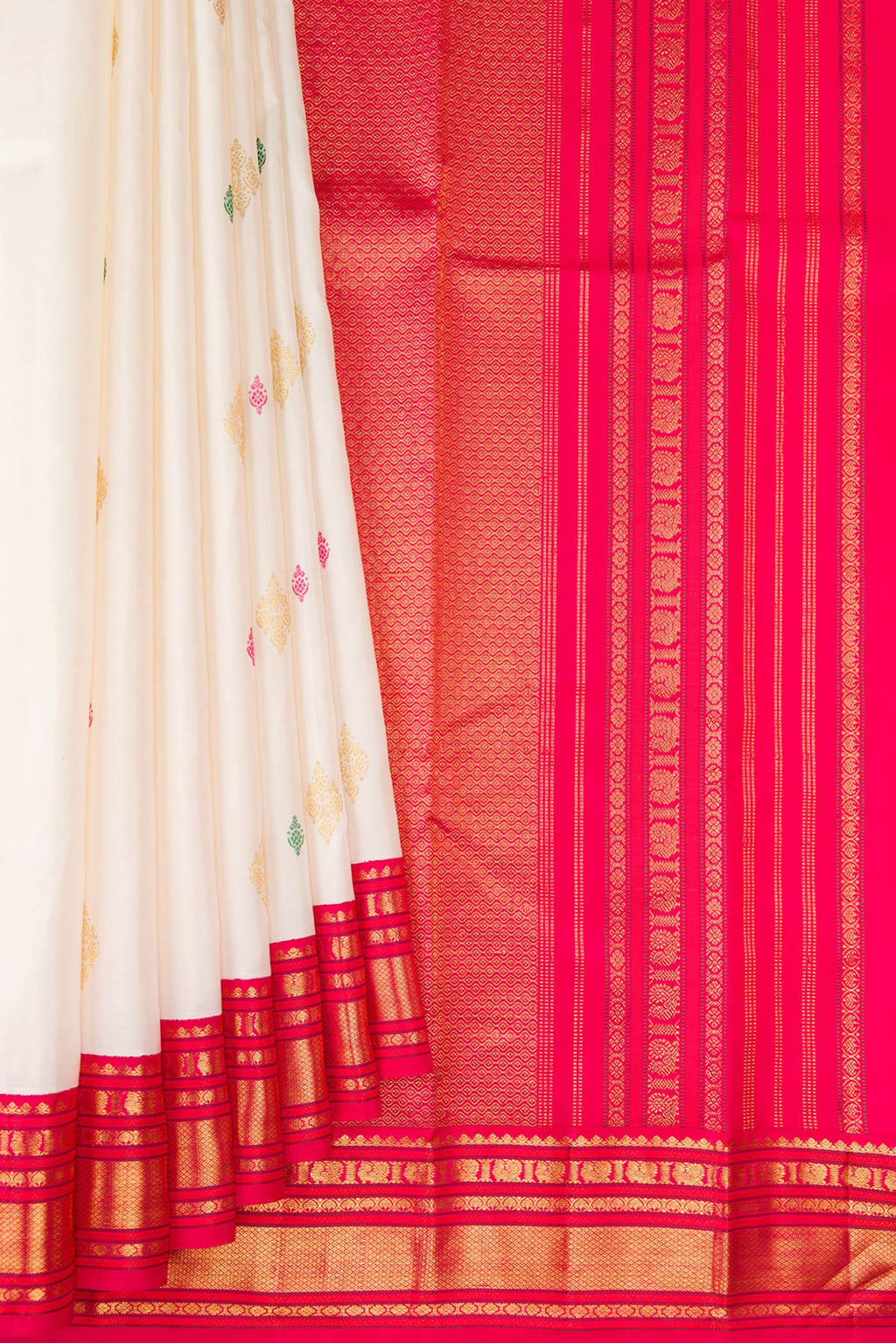 Pleats and pallu of White Kanjivaram Silk Saree with Zari And Thread Butta on the body and Zari Border. 