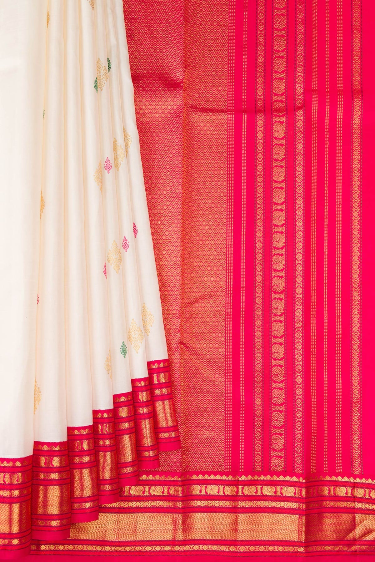 Pleats and pallu of White Kanjivaram Silk Saree with Zari And Thread Butta on the body and Zari Border. 
