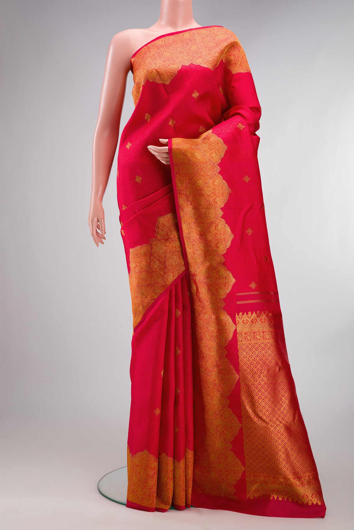 Pure Silk Dark Pink Dual Tone Kanchipuram Saree with Jacquard With Zari Butta on the body and Fancy Border.  displayed on a mannequin