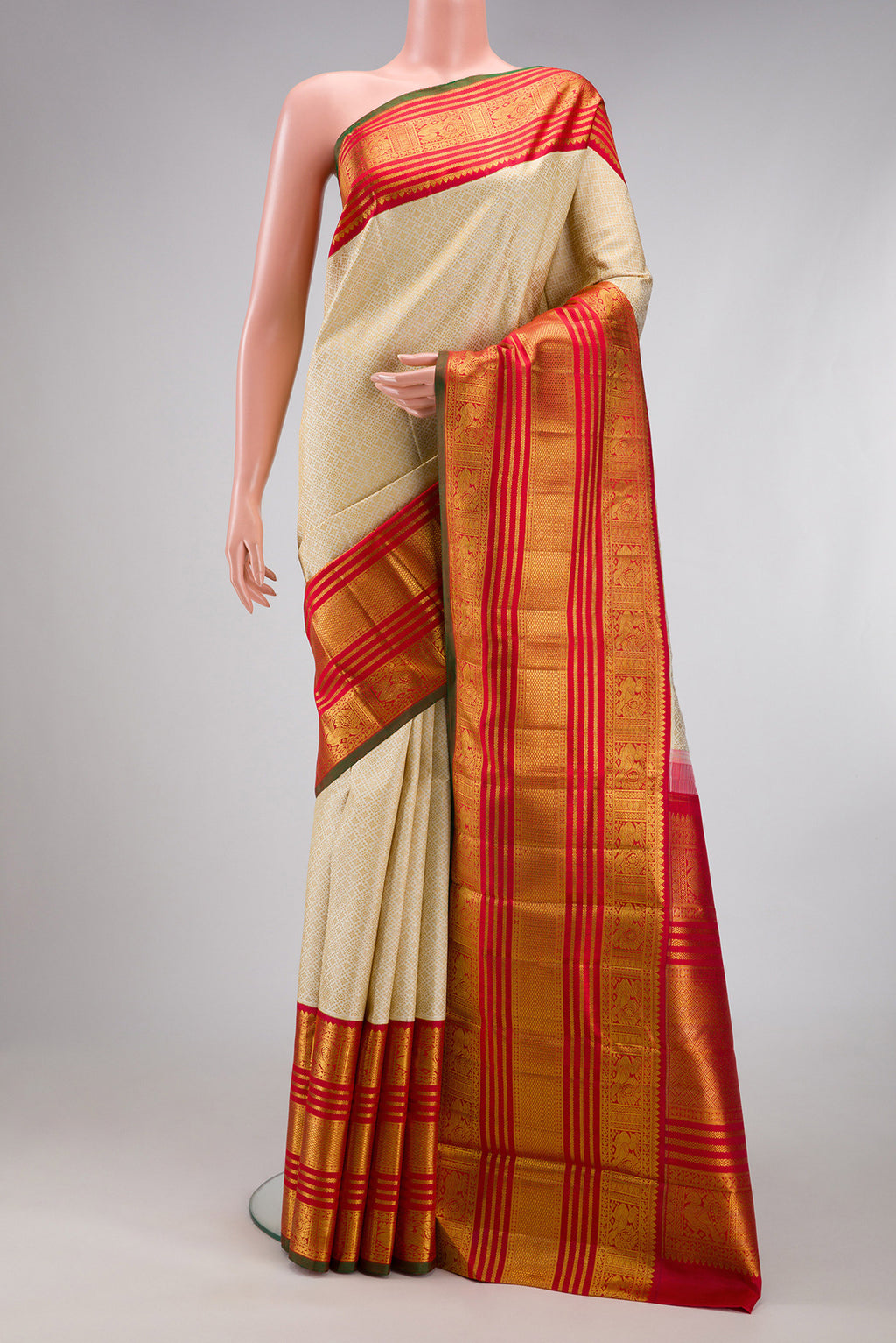 Pure Silk Pure Zari Off White Kanchipuram Saree with Jacquard design on the body and Zari Border.  displayed on a mannequin