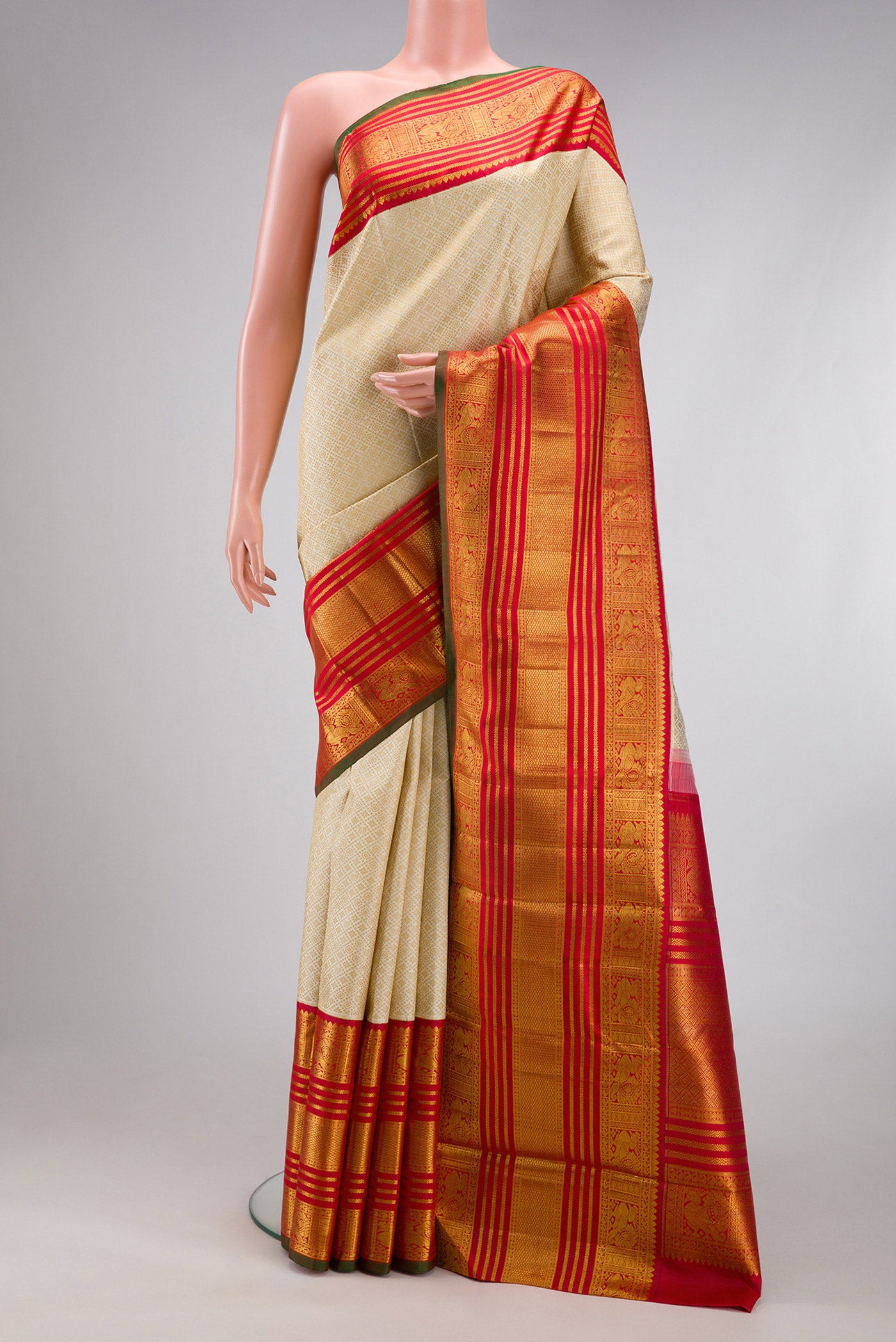 Pure Silk Pure Zari Off White Kanchipuram Saree with Jacquard design on the body and Zari Border.  displayed on a mannequin