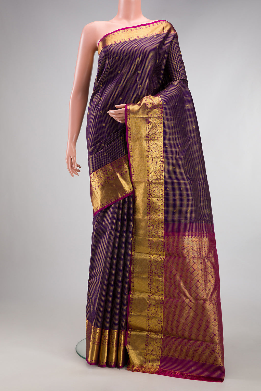 Purple Kanjivaram Silk Saree with Checked design on the body and Zari Border.  displayed on a mannequin