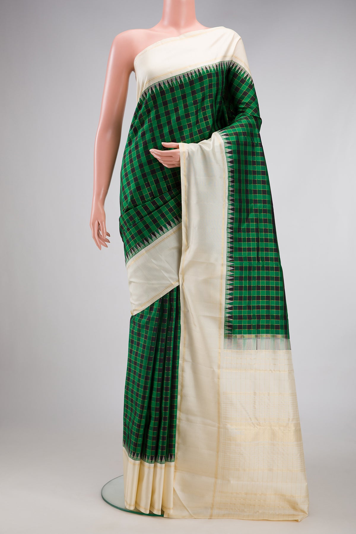 Multi Color Kanjivaram Silk Saree with Checked design on the body and Plain Border.  displayed on a mannequin