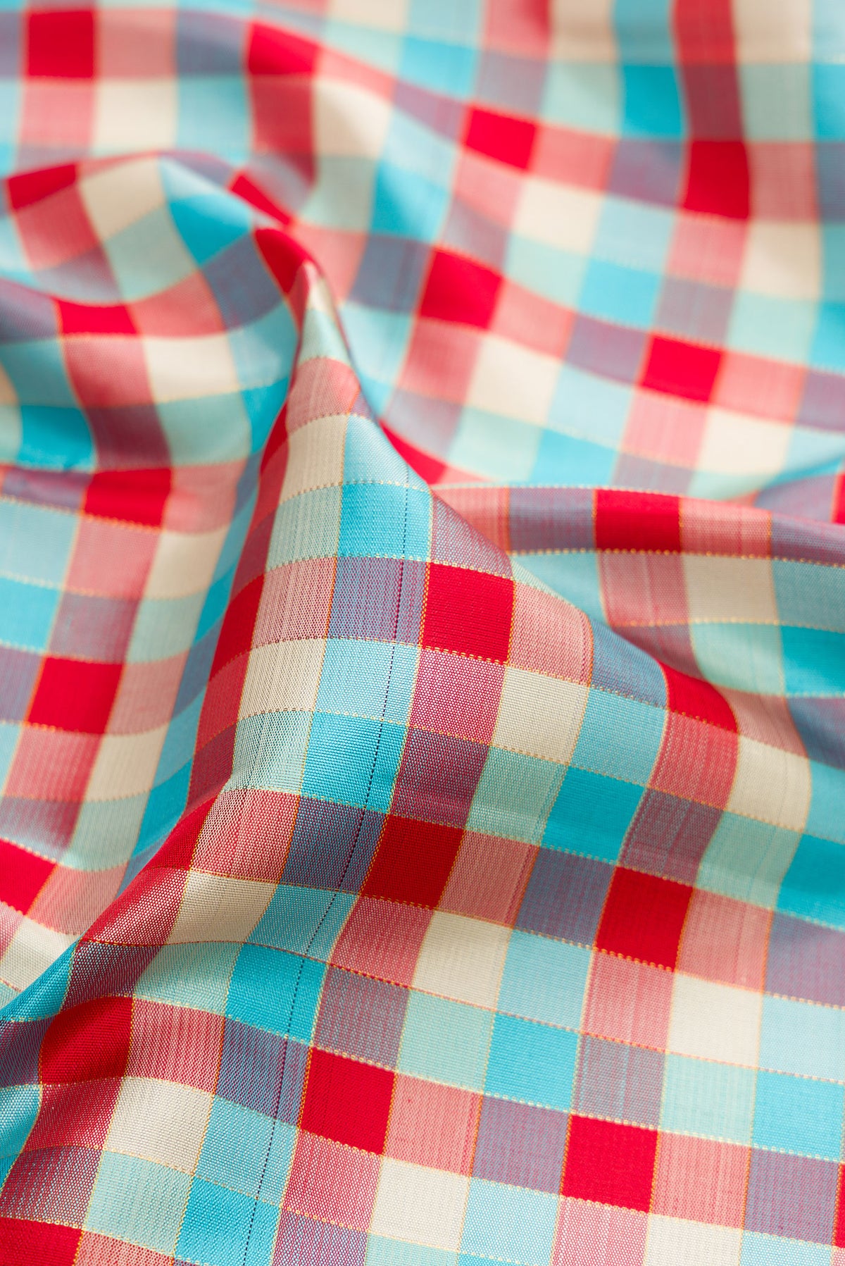 Close up of Multi Color Kanjivaram Silk Saree with Checked design on the body and Fancy Border.  displaying folds
