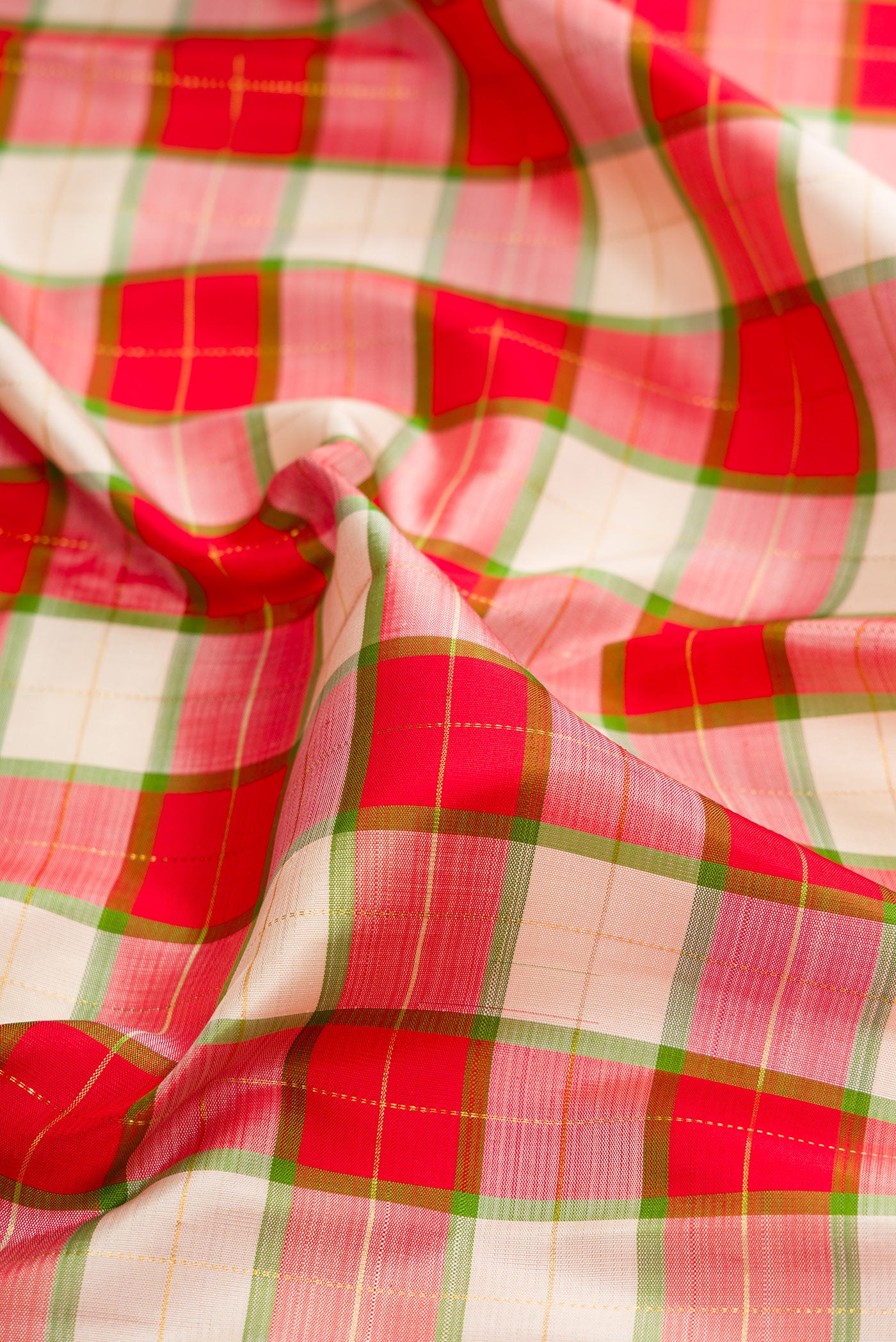 Close up of Multi Color Kanjivaram Silk Saree with Checked design on the body and Plain Border.  displaying folds
