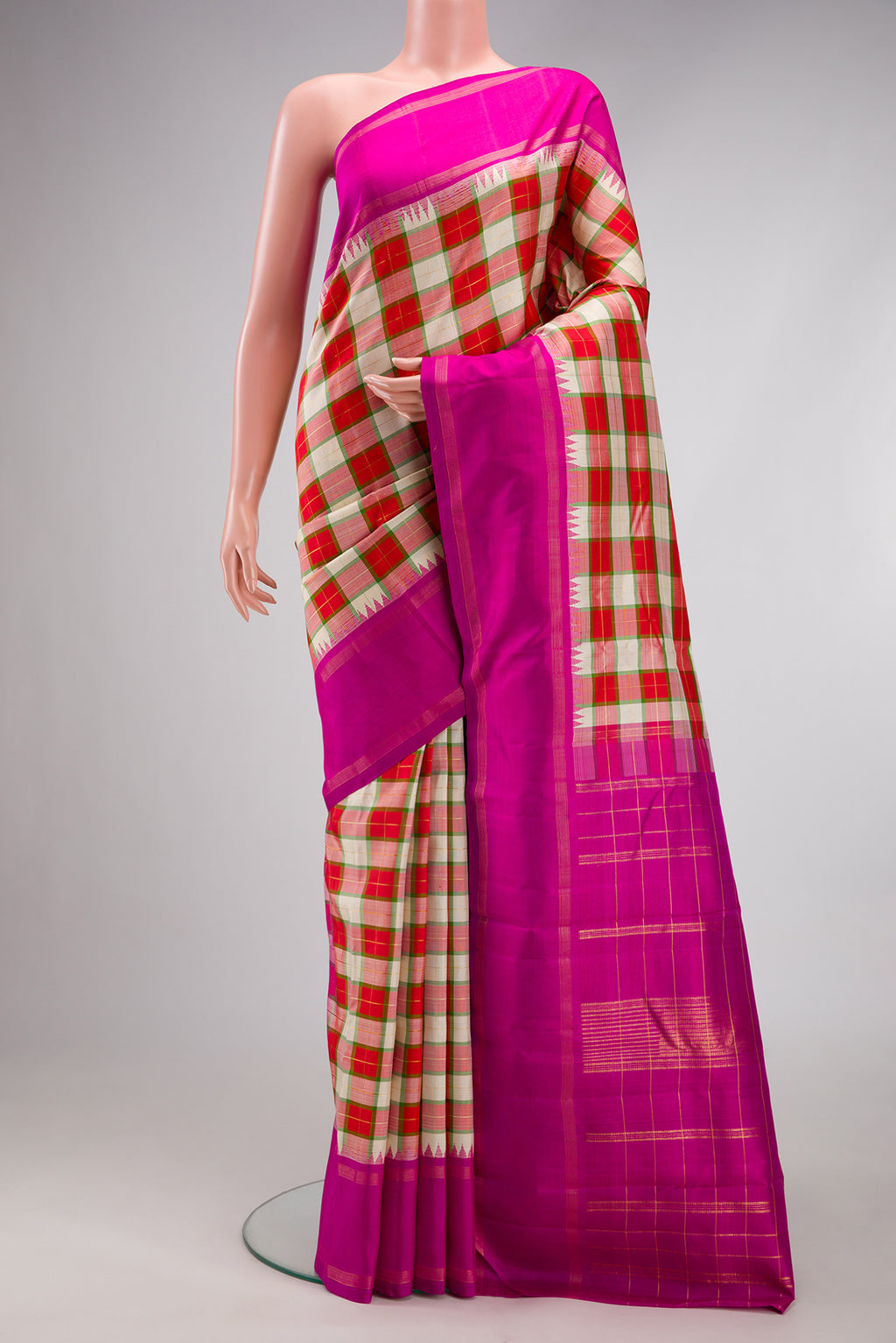 Multi Color Kanjivaram Silk Saree with Checked design on the body and Plain Border.  displayed on a mannequin