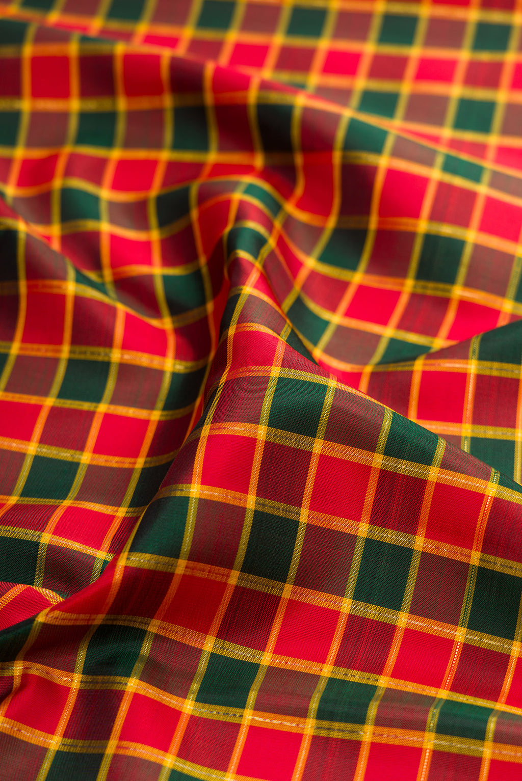 Close up of Multi Color Kanjivaram Silk Saree with Checked design on the body and Zari Border.  displaying folds