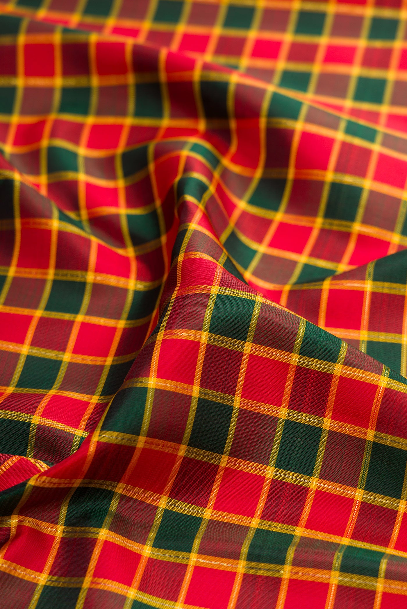Close up of Multi Color Kanjivaram Silk Saree with Checked design on the body and Zari Border.  displaying folds