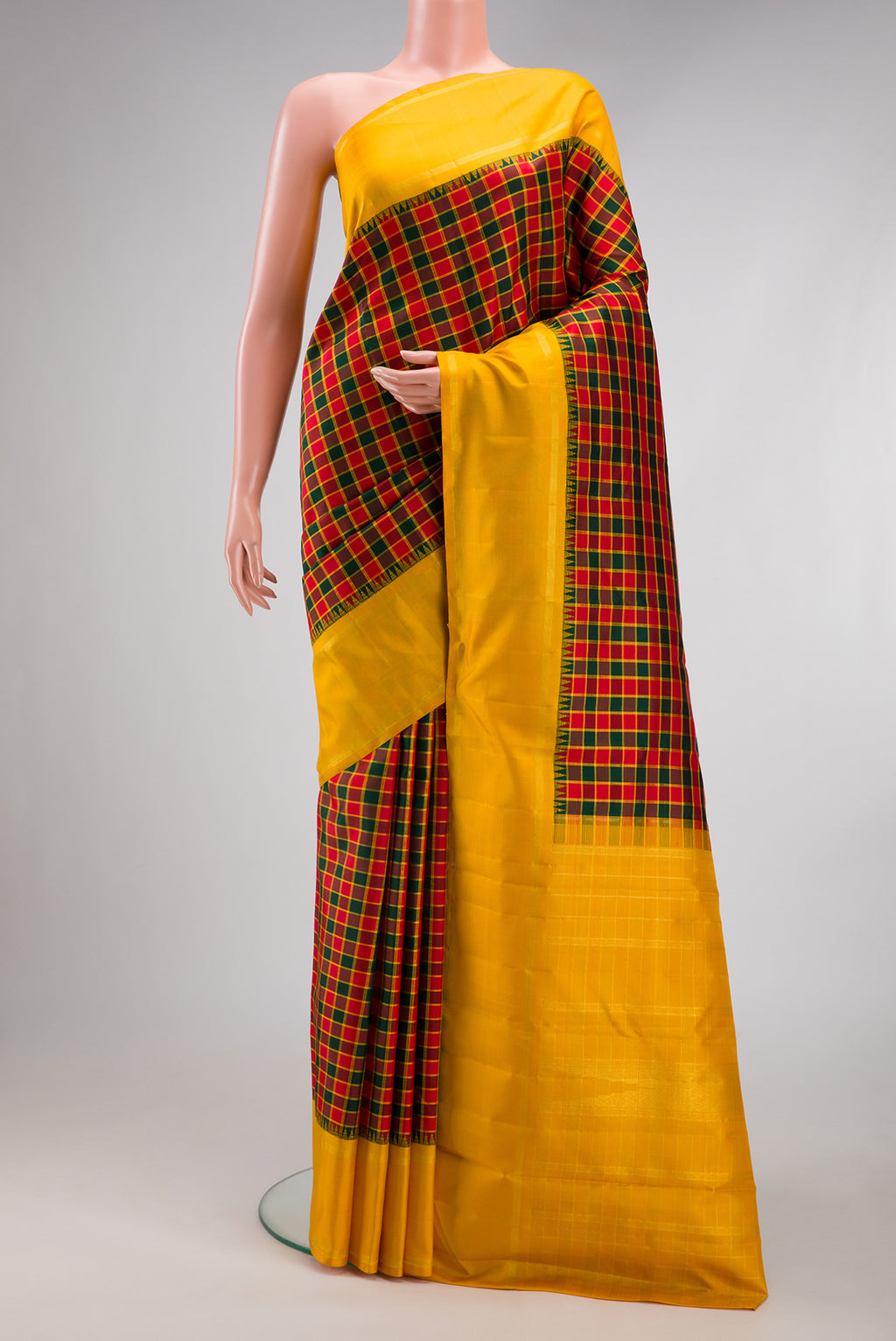 Multi Color Kanjivaram Silk Saree with Checked design on the body and Zari Border.  displayed on a mannequin