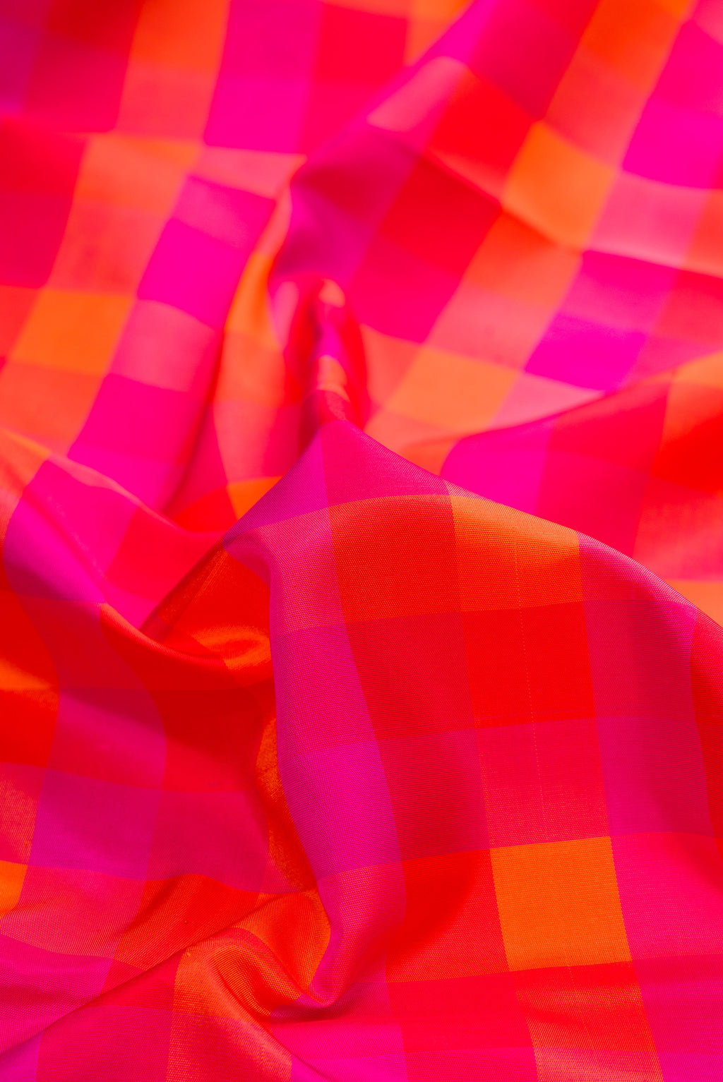 Close up of Pure Silk Multi Color Kanchipuram Saree with Checked design on the body and Without Border.  displaying folds