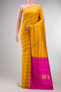Pure Silk Mustard Kanchipuram Saree with Checked design on the body and Thin Zari Line.  displayed on a mannequin