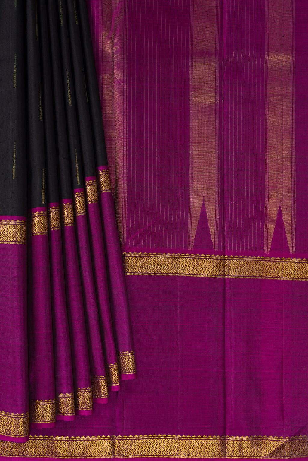 Pleats and pallu of Black Kanchipuram Silk Saree with Zari Butta on the body and Ganga Jamuna Border. 