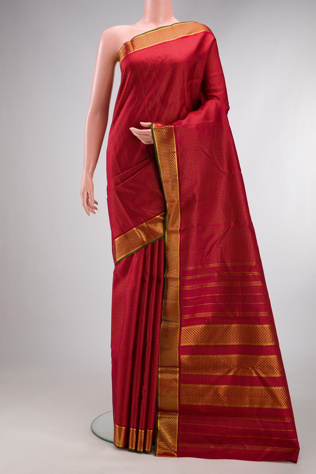 Pure Silk Maroon Kanchipuram Saree with Checked design on the body and Zari Border.  displayed on a mannequin