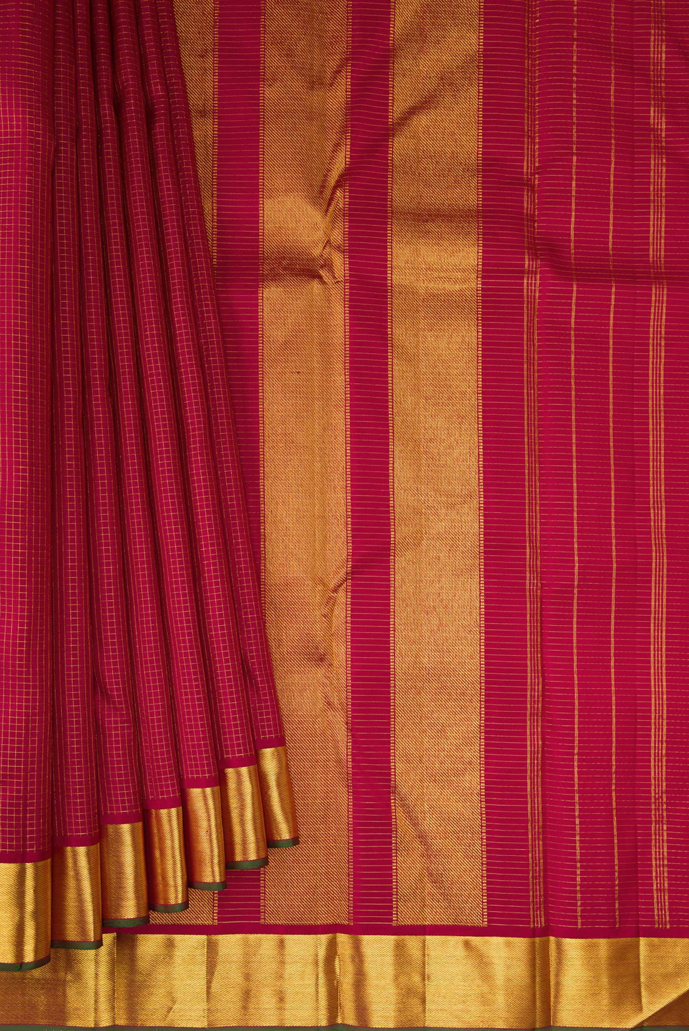 Pleats and pallu of Maroon Kanchipuram Silk Saree with Checked design on the body and Zari Border. 