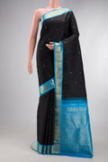 Black Kanjivaram Silk Saree with Zari Butta on the body and Zari Border.  displayed on a mannequin