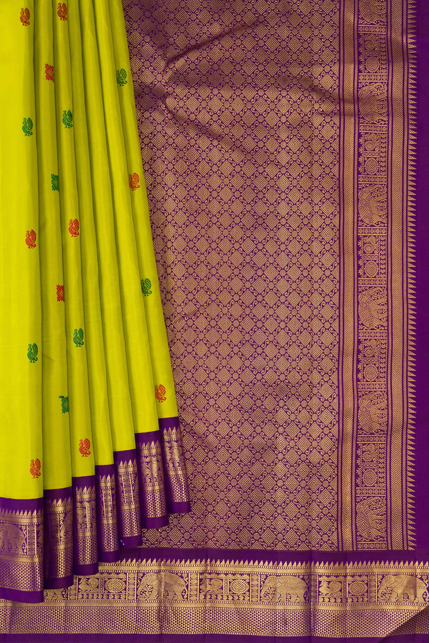 Pleats and pallu of Parrot Green Kanjivaram Silk Saree with Thread Butta on the body and Zari Border. 
