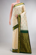 Sandal Kanjivaram Silk Saree with Thread Butta on the body and Zari Border.  displayed on a mannequin