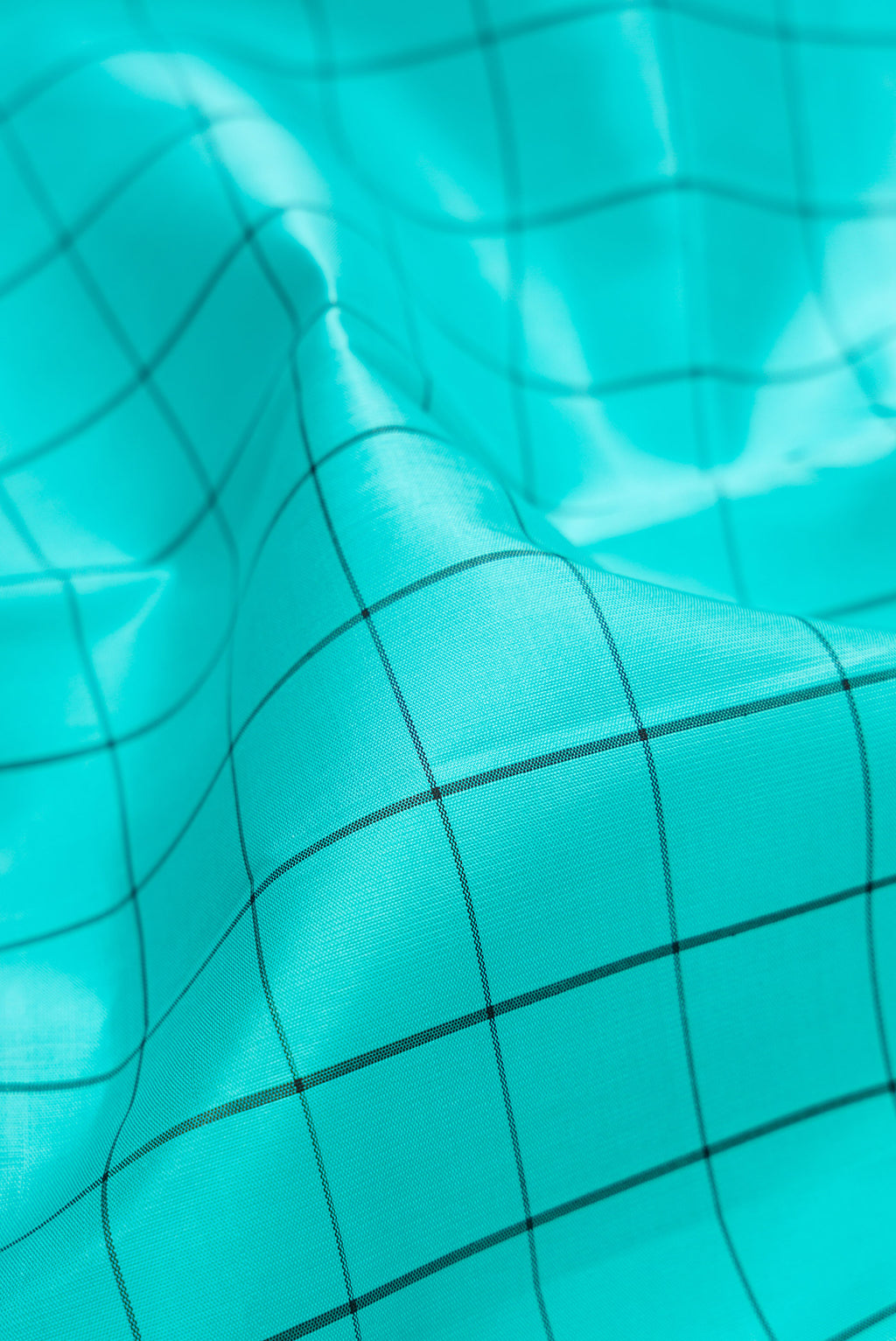 Close up of Sky Blue Kanjivaram Silk Saree with Checked design on the body and Fancy Border.  displaying folds