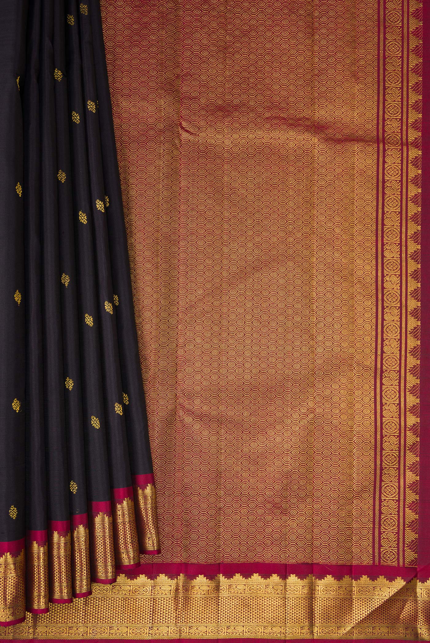 Pleats and pallu of Black Kanjivaram Silk Saree with Zari Butta on the body and Zari Border. 