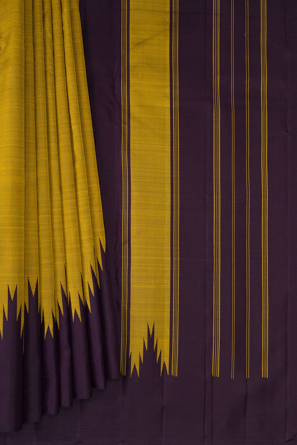 Pleats and pallu of Mehandi Green Kanjivaram Silk Saree with Plain Body and Temple Border. 
