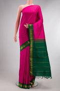 Pure Silk Pure Zari Dark Pink Kanjivaram Saree with Plain Body and One Side Border.  displayed on a mannequin