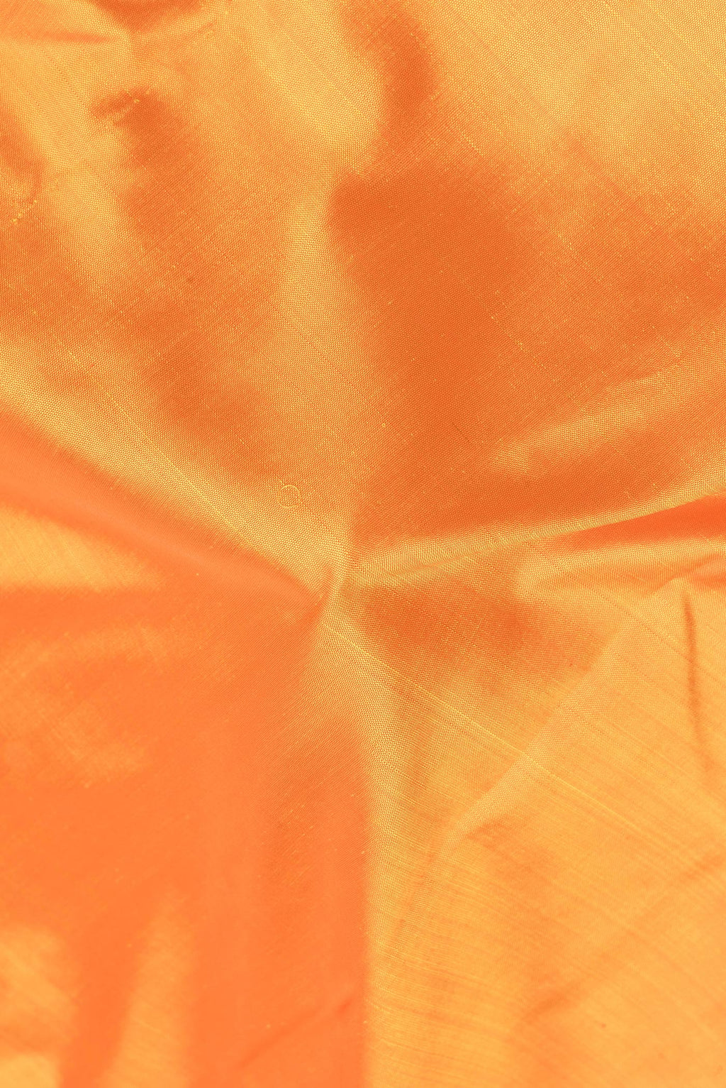 Close up of Pure Silk Pure Zari Yellow Dual Tone Kanjivaram Saree with Plain Body and One Side Border.  displaying folds