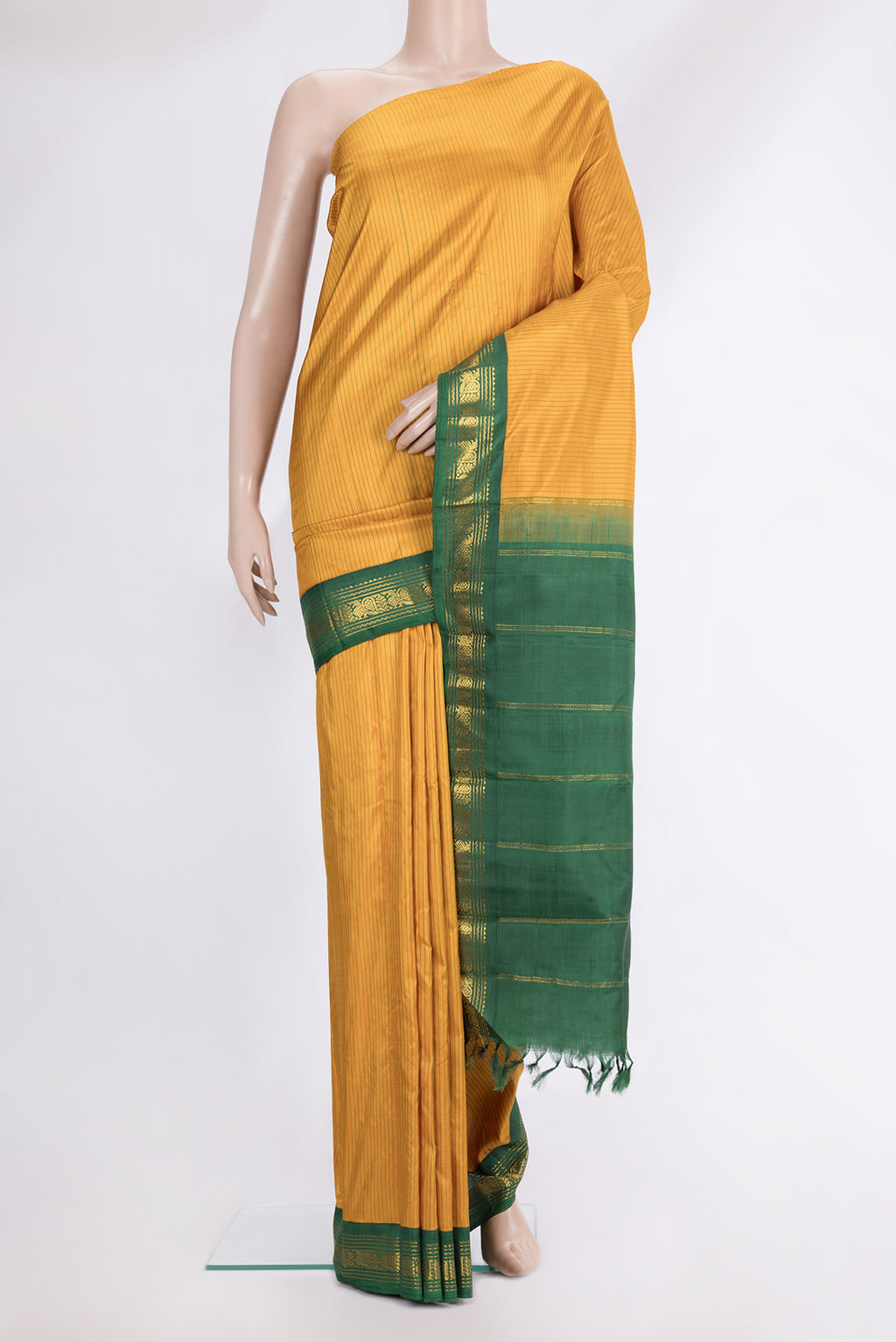 Pure Silk Pure Zari Mustard Kanjivaram Saree with Stripes on the body and One Side Border.  displayed on a mannequin