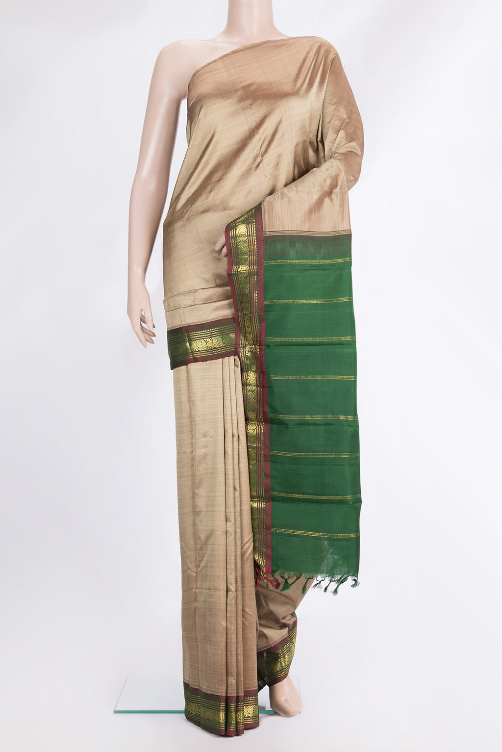 Pure Silk Pure Zari Dark Beige Dual Tone Kanjivaram Saree with Plain Body and One Side Border.  displayed on a mannequin