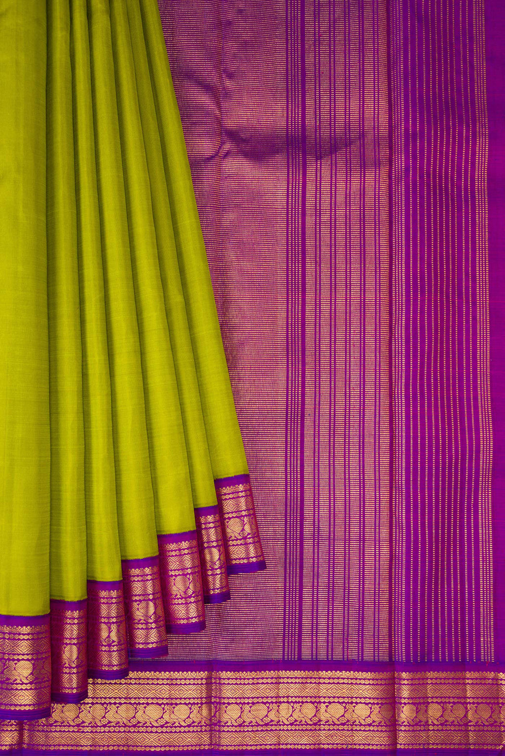 Pleats and pallu of Parrot Green Kanjivaram Silk Saree with Plain Body and Zari Border. 