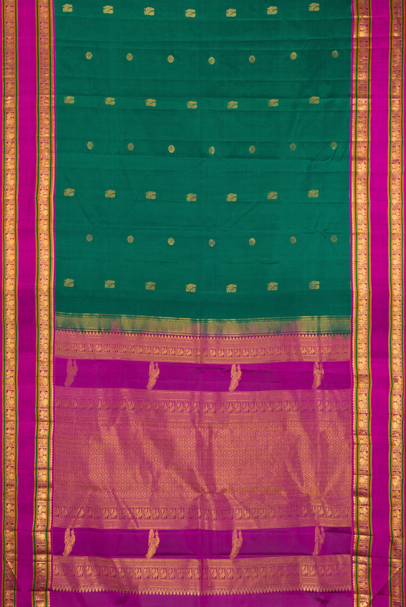 Flat view of Teal Kanchipuram Silk Saree with Zari Butta on the body and Zari Border. 