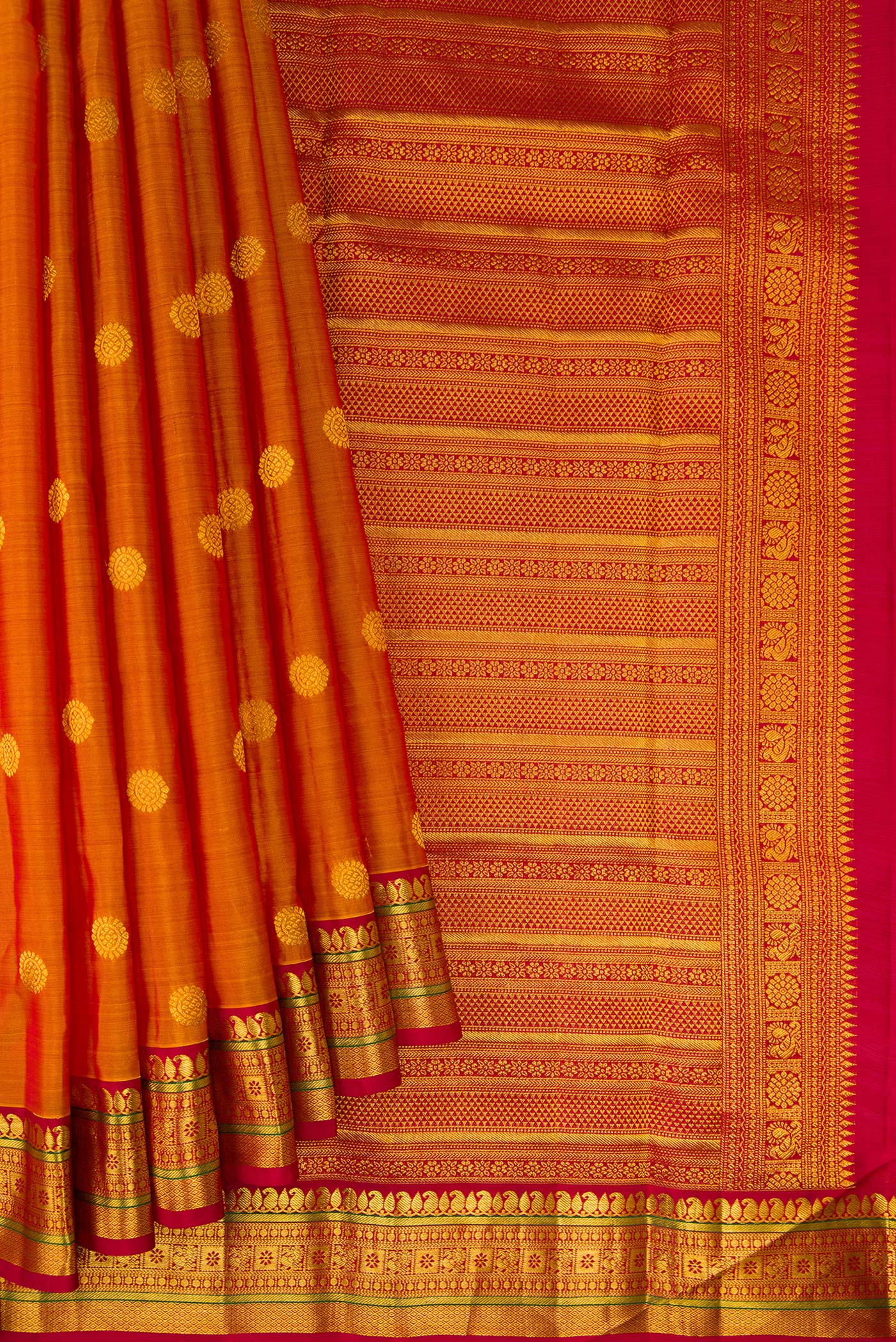 Pleats and pallu of Mustard Kanchipuram Silk Saree with Zari Butta on the body and Zari Border. 