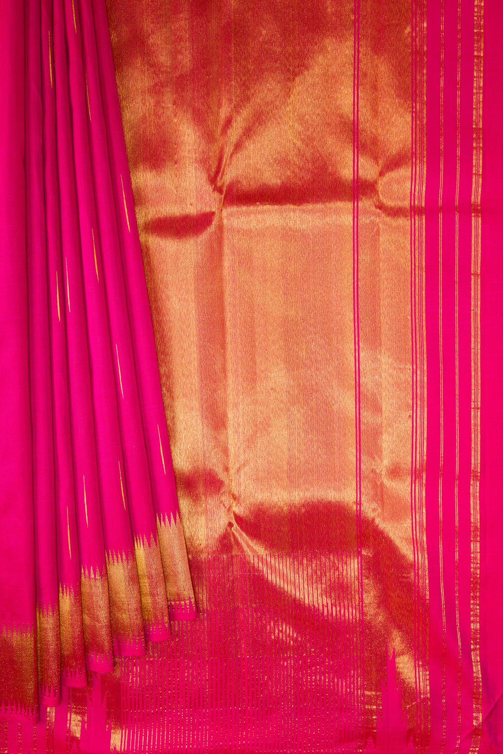 Pleats and pallu of Dark Pink Kanjivaram Silk Saree with Zari Butta on the body and Zari Border. 