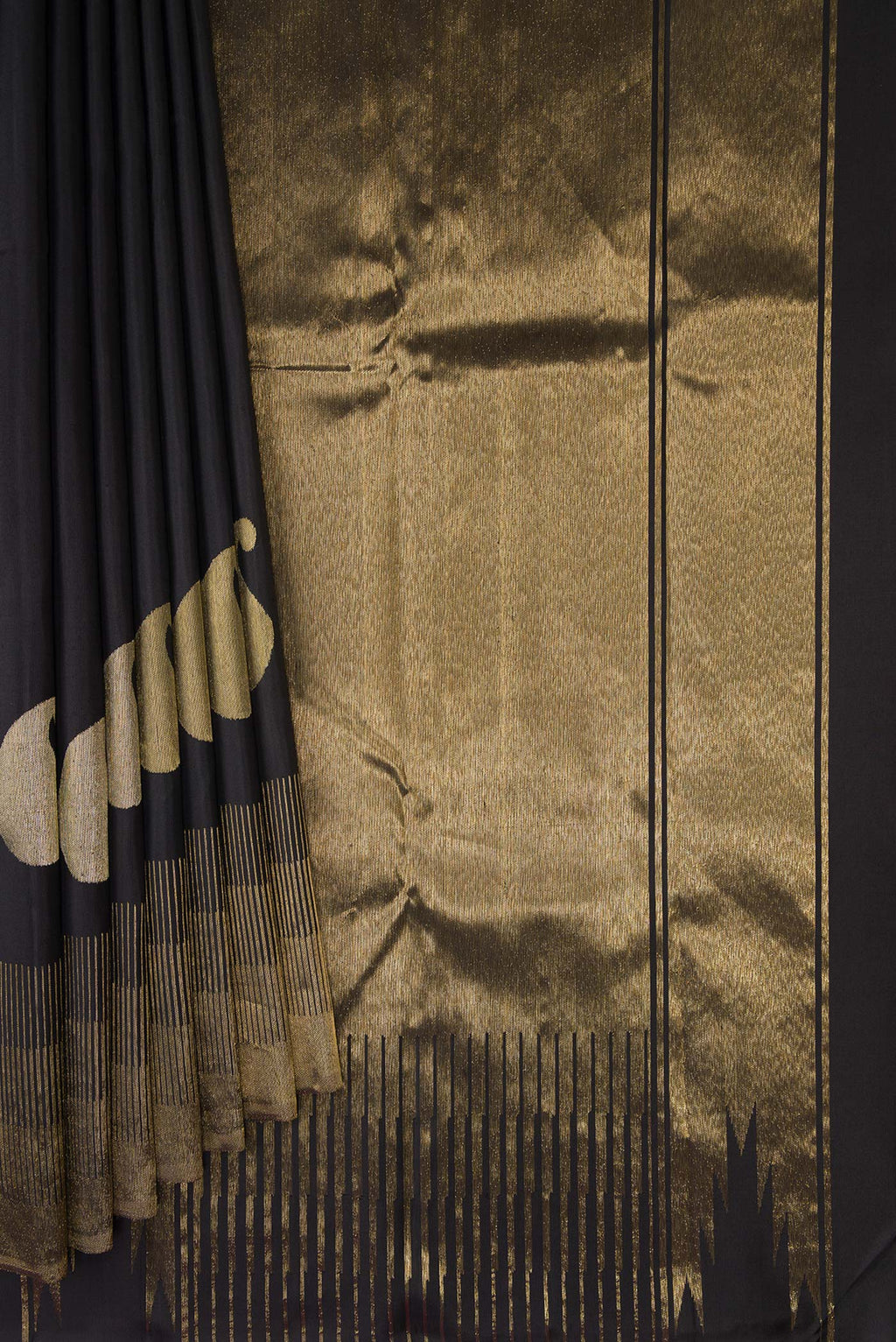 Pleats and pallu of Black Kanchipuram Silk Saree with Plain Body and Zari Border. 