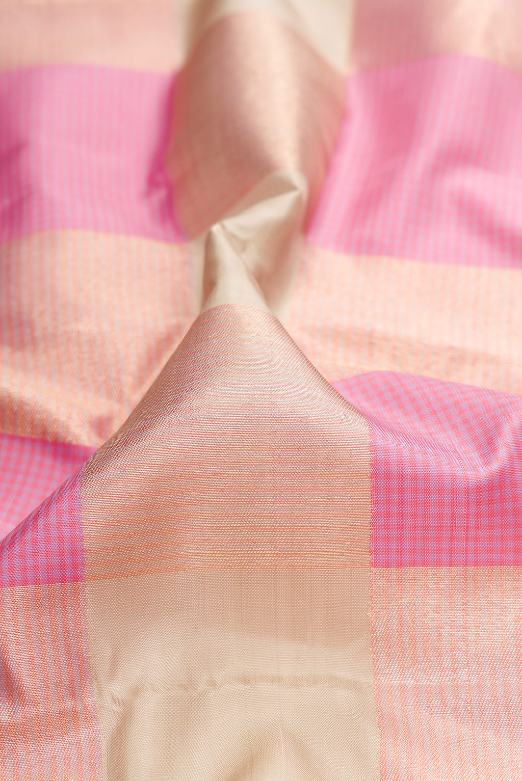 Close up of Pure Silk Multi Color Kanchipuram Saree with Checked design on the body and Zari Border.  displaying folds